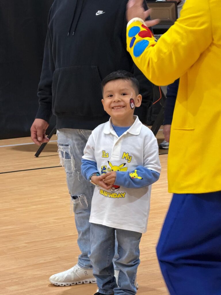 Birthday boy smiling at his party at Westchester Sports Arena